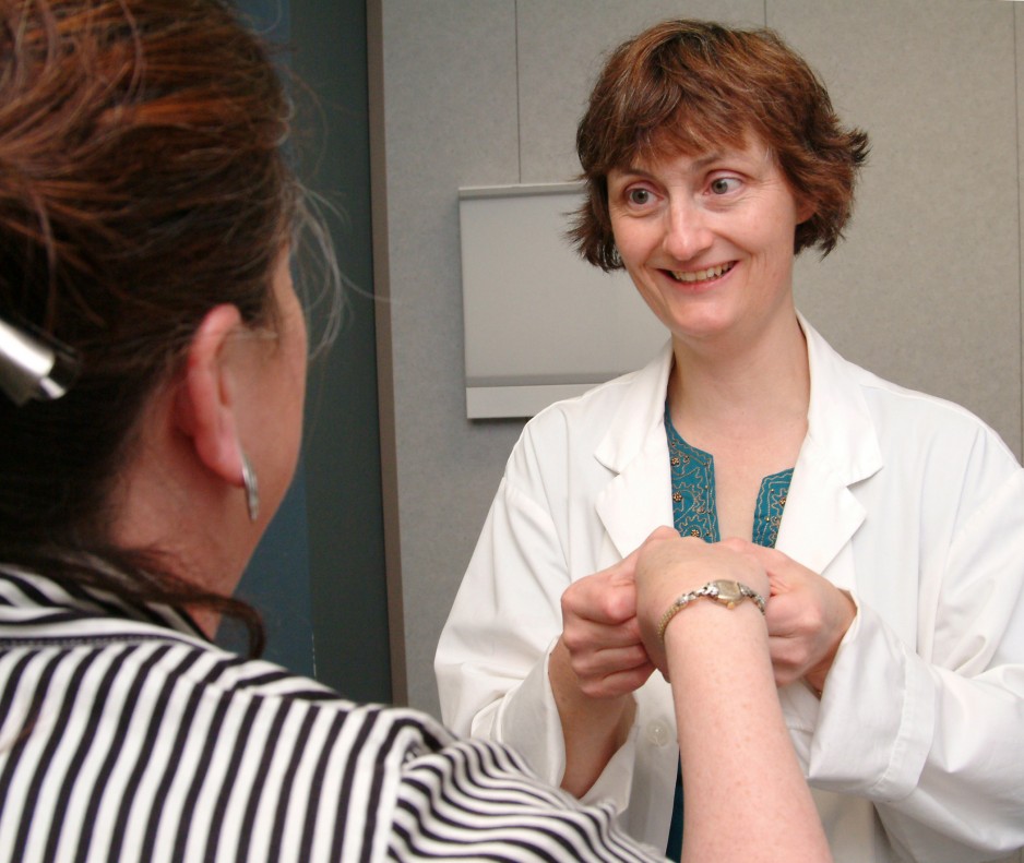 Dr. Pope works with a patient to help diagnose their rheumatology issues.