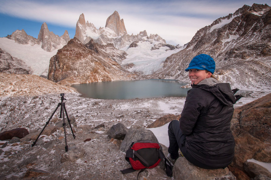 Jessica sitting on the rocky ground on a mountainous area in Argentina
