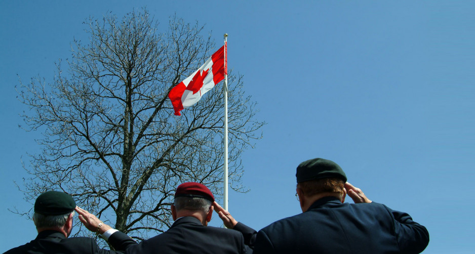veterans salute Canadian flag