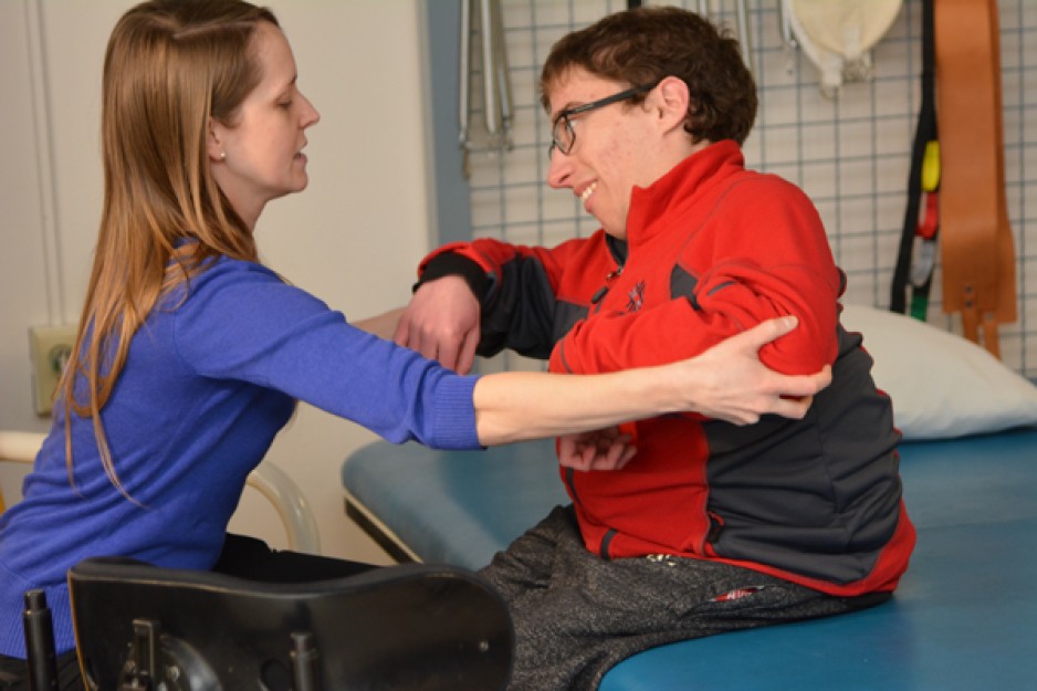 A patient and caregiver work together in the TLC program.