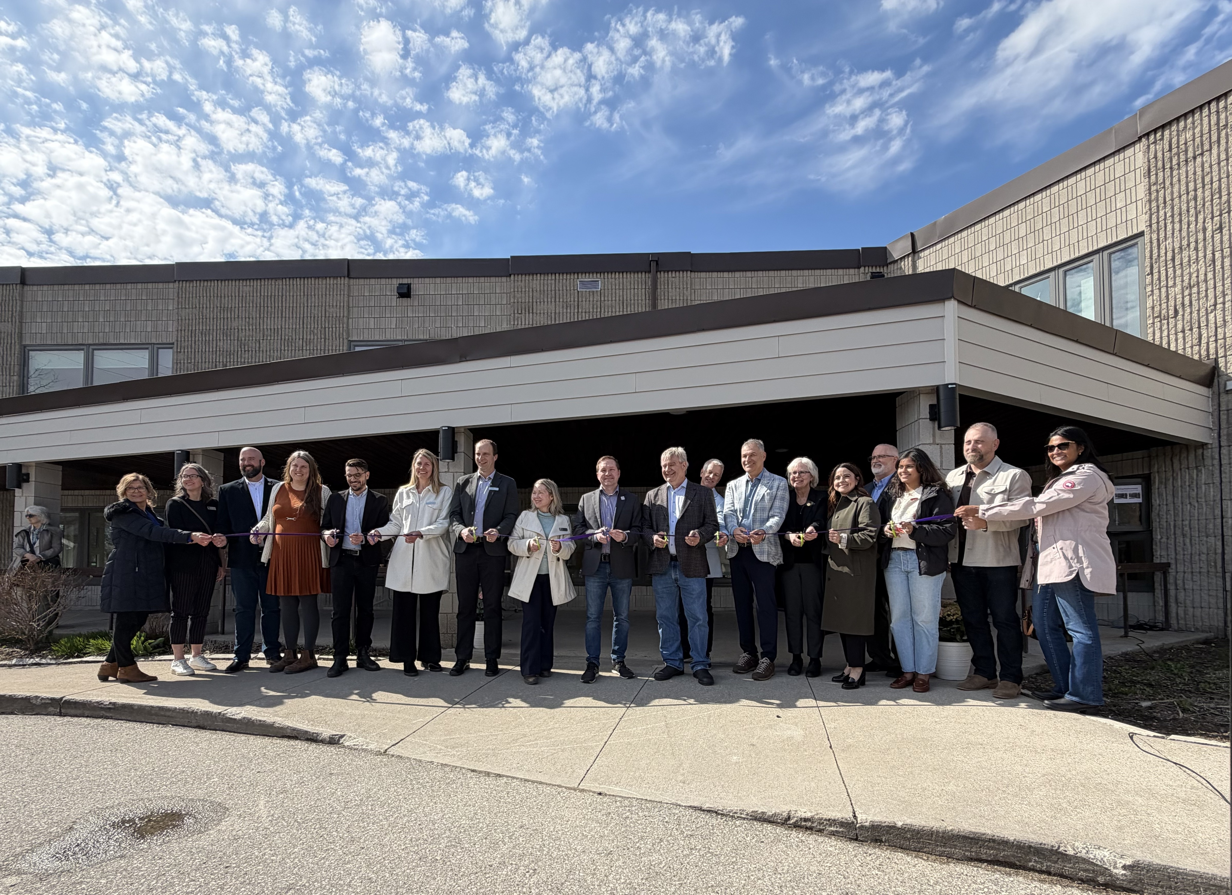 Local dignitaries take part in a ribbon cutting ceremony April 9, 2026 to officially open the doors at Coves Landing.
