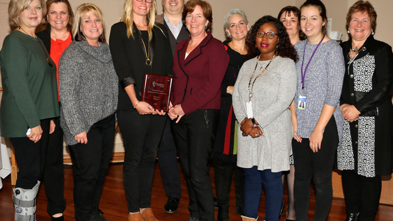 The Indwell team pose for a group photo.