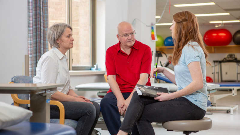 conferring with caregiver