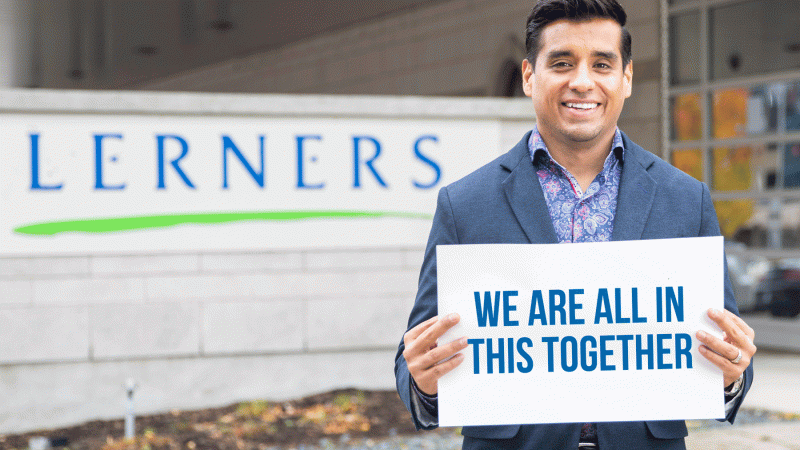 A man holds up a sign