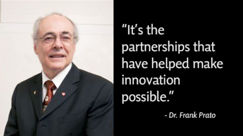  headshot of a man with gray hair and glasses wearing a dark suit with a white shirt and glasses, with a quote beside him on a black background. The quote says , "It's the partnerships that helped make innovation possible",  and below it is "Dr. Frank Prato written in smaller font and italics