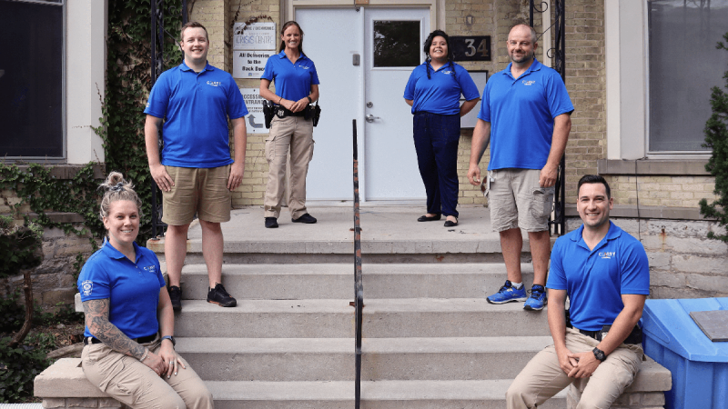 members of the COAST team standing on a stairway outside a building