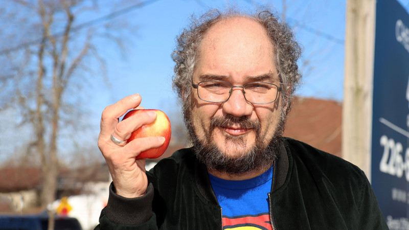 Mark Alfieri holding an apple