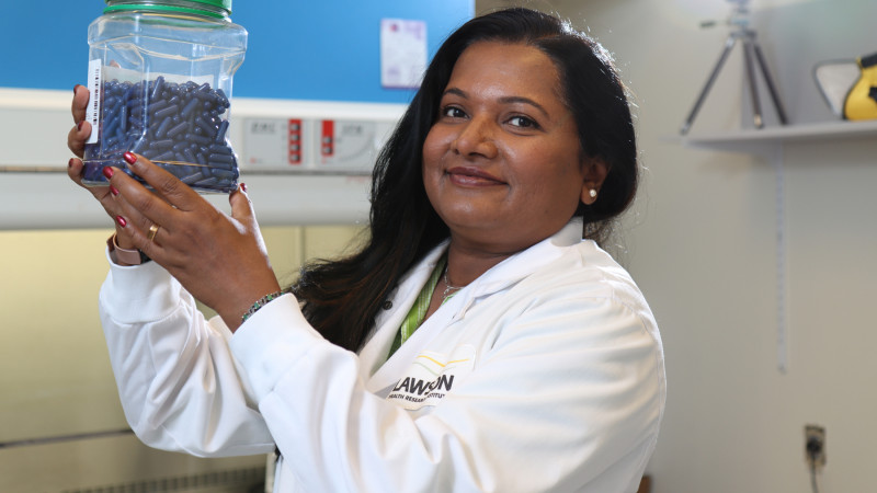 Seema Nair Parvathy (PhD), Research Coordinator with Lawson Health Research Institute, holds up fecal transplant capsules being used at St. Joseph’s Health Care London to treat patients with C. difficile and to study their potential use for many other health conditions.