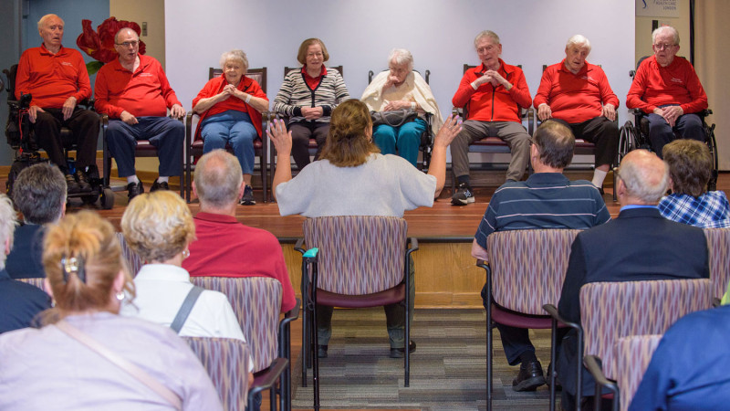 members of the Veterans choir performing on stage