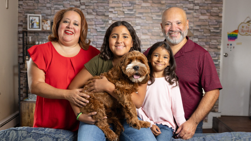 The Rivas family with their dog