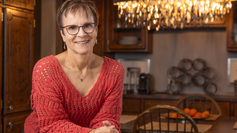 Micheline leaning up against a counter