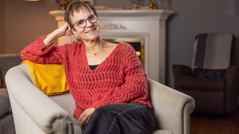 Micheline sitting down leaning on her hand
