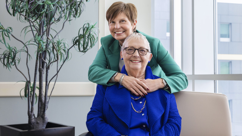 Person hugging another from behind