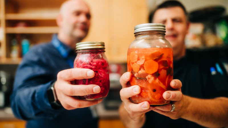 chefs with fermented food jars