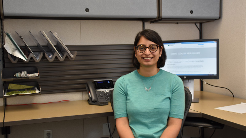 Dr. Swati Mehta poses in front of her desk.