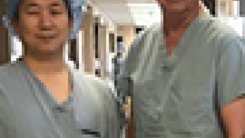 Dr. Denstedt with urologic surgeons in training