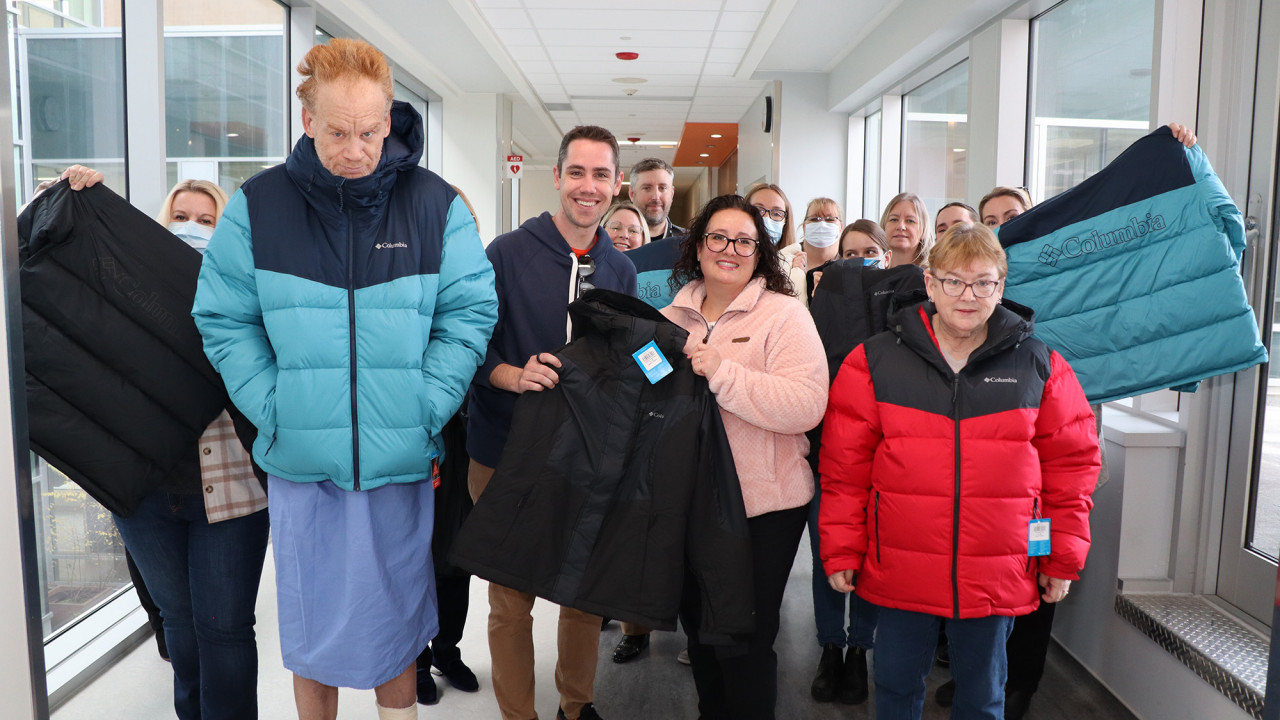 St. Joseph's patients and Will Heeman showcasing the newly donated Columbia jackets