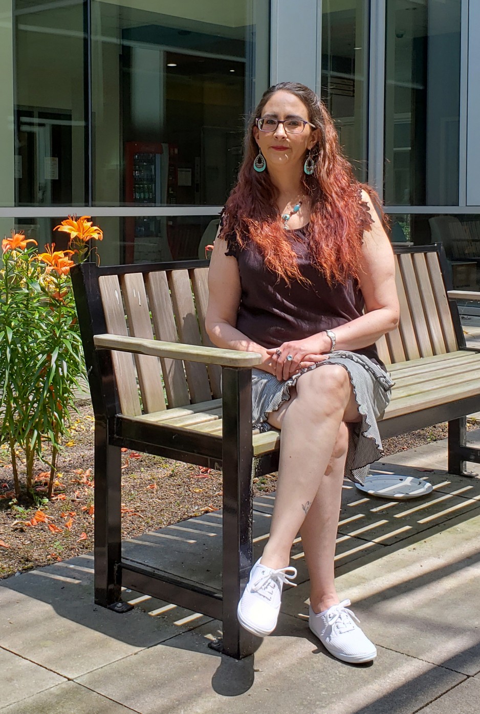 Belinda Rogers-King sitting on a bench at Parkwood Mental Health Care Building
