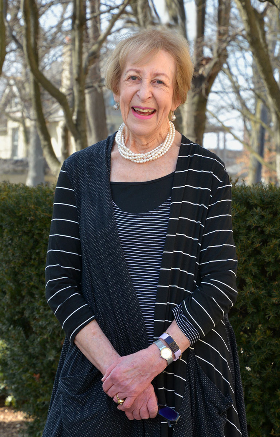 Dr. Sandra Fisman standing outside, wearing blue sweater