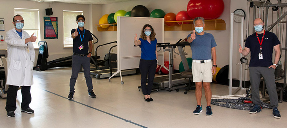 Michael Kan and four staff members in the rehabilitation gym at Parkwood Institute