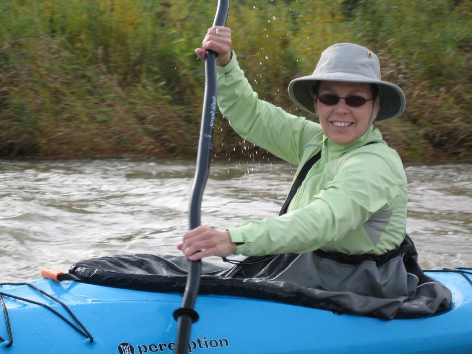 Lori paddling in a kayak