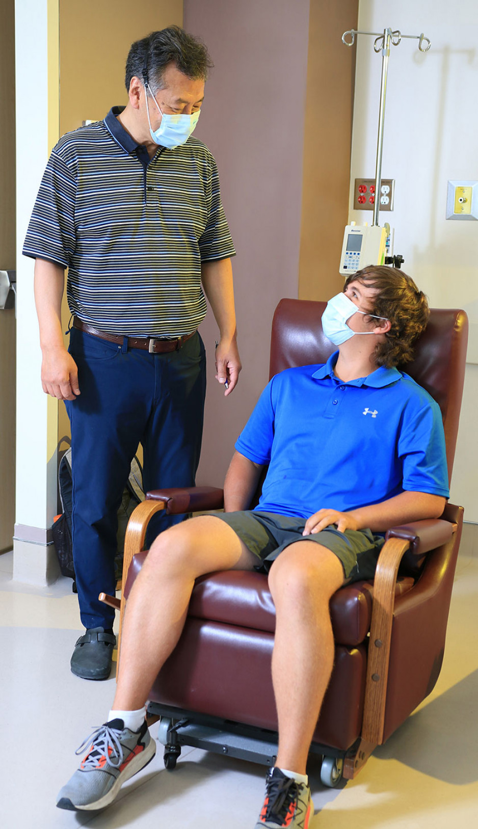 Dr. Harolde Kim standing next to Joel McLaughlin at the Allergy Clinic at St. Joseph's Hospital