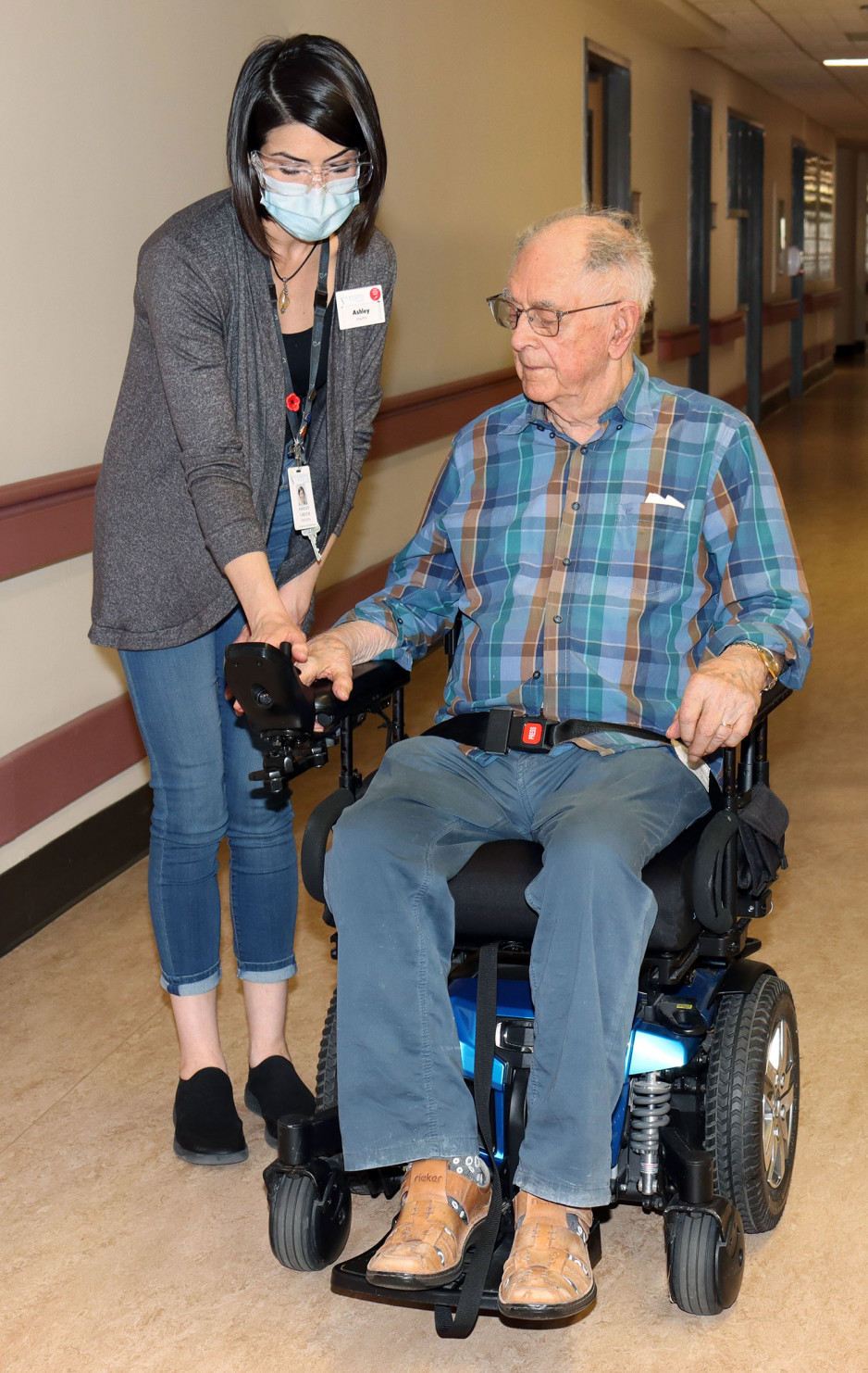 an occupational therapist helping a veteran learn how to use a mobility scooter