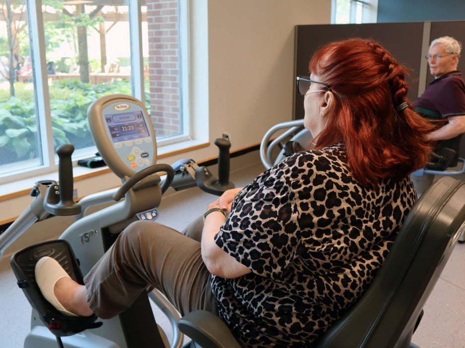 two people using exercise machines
