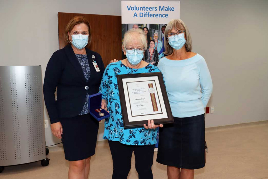 Sovereign Mdeal  winner Chris pictured with St. Joseph's staff members