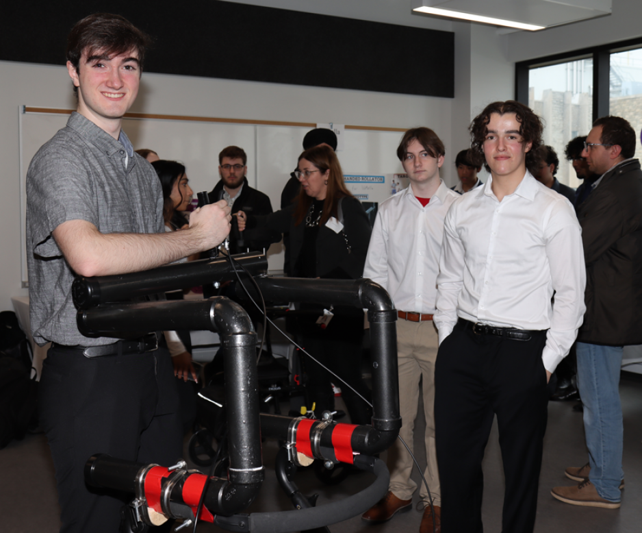 students demoing their engineered roller device 