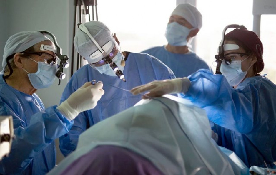 doctors performing surgical procedure in the operating room