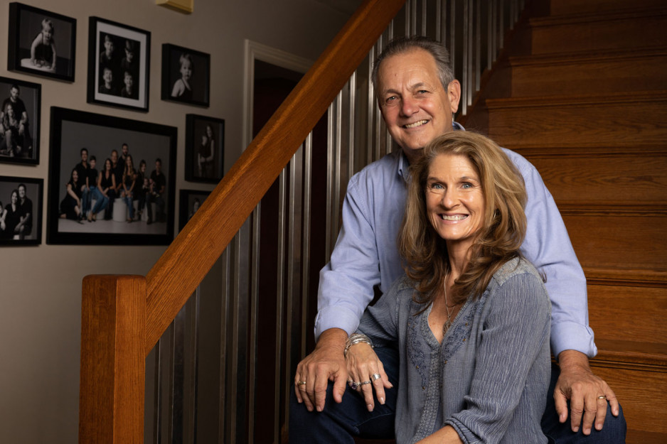 Paul and Kim Spriet sitting on stairwell
