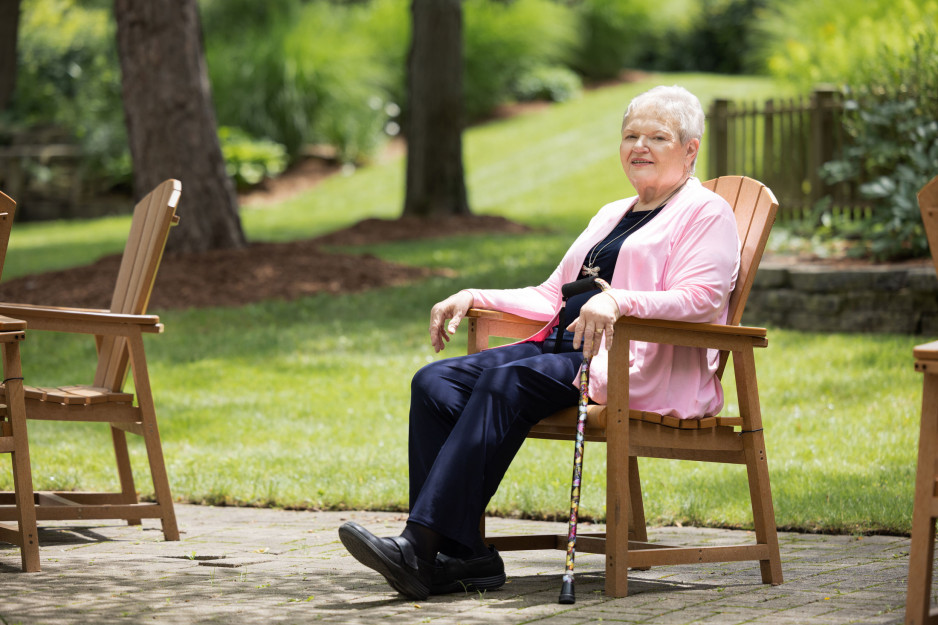 Woman sitting outside on a chair