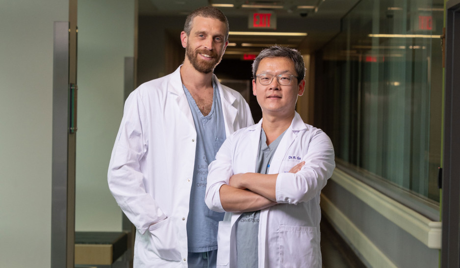 Dr. Daniel Paccot Burnens and Dr. Ryan Gao wearing lab coats