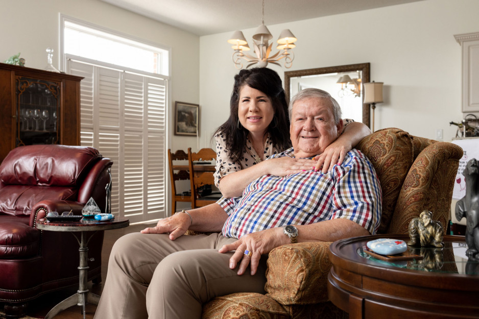 Doug Webber and his daughter Kareen with her arms around him