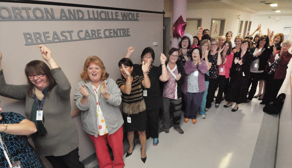 Crowd of people cheering at the grand opening of the Norton and Lucille Wolf Breast Care Centre