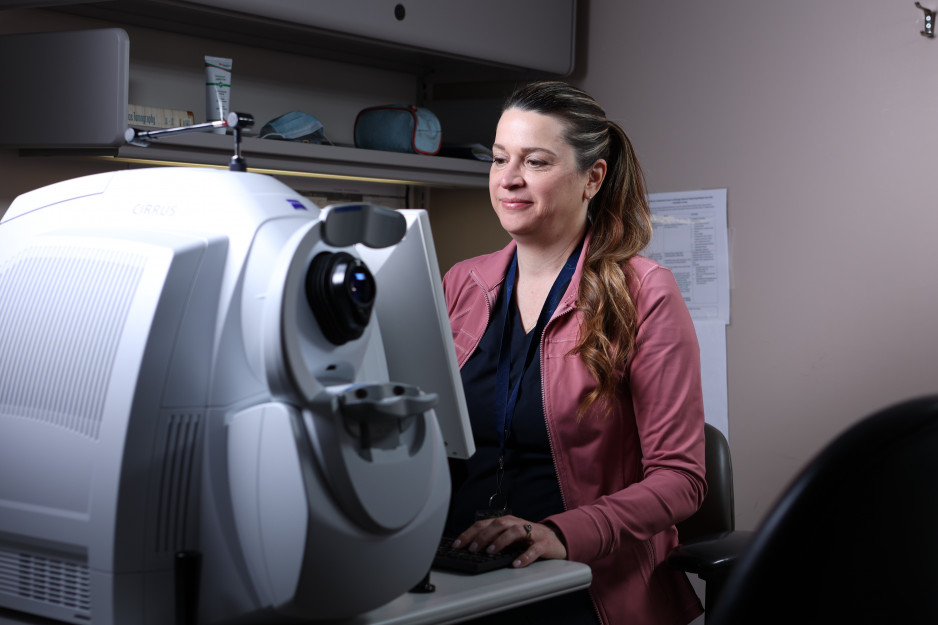 A woman looking at a computer.