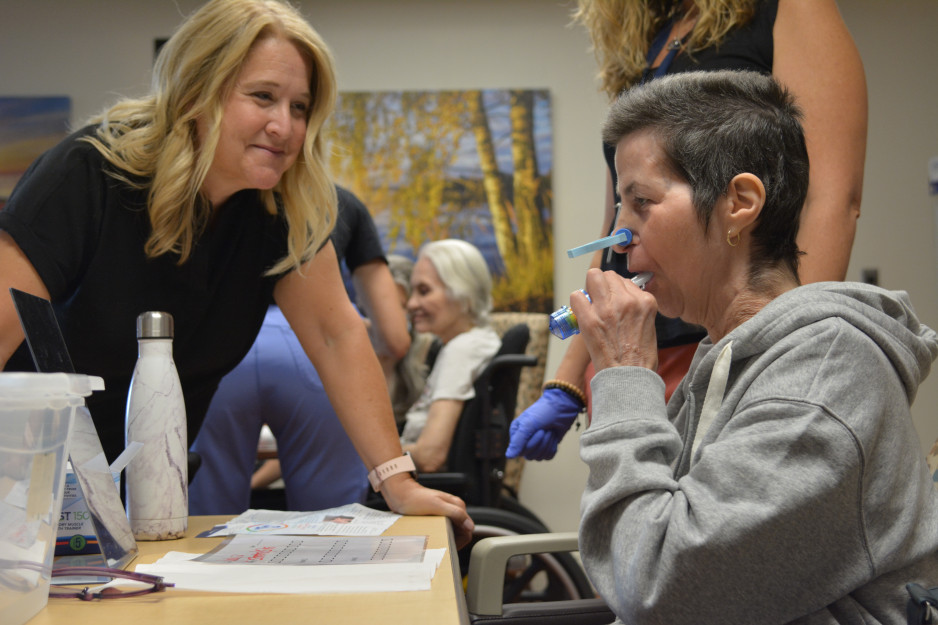 Speech language pathologist with patient