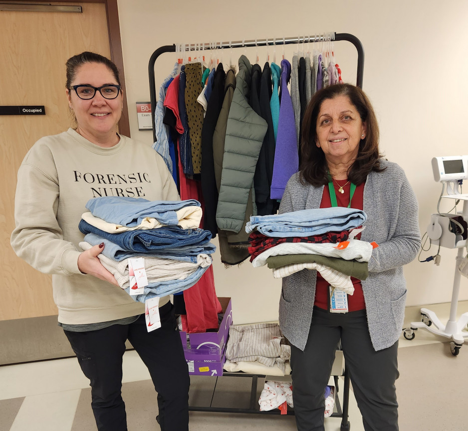 nurses holding donated clothing for sexual assault victims