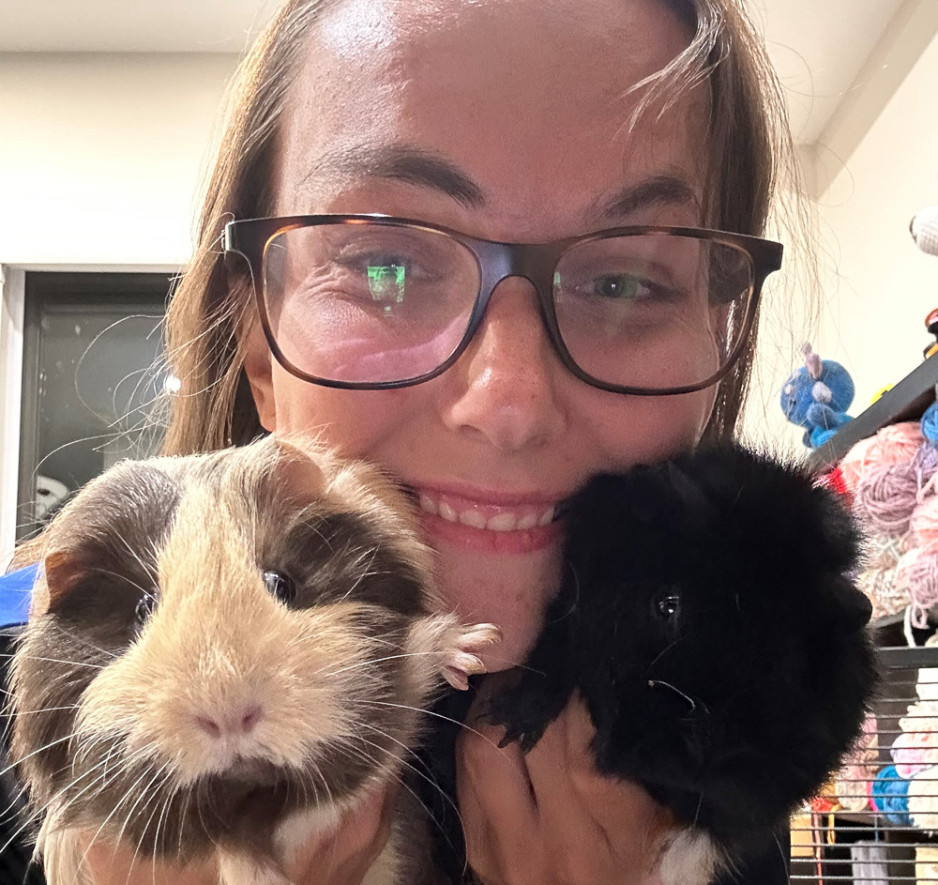 woman cuddling her gerbils