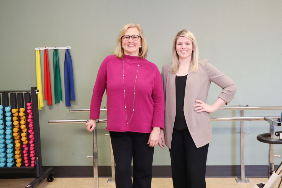 Two women standing side by side
