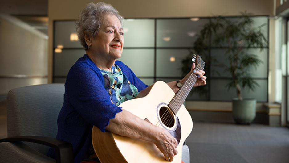 Fern McNab holding a guitar
