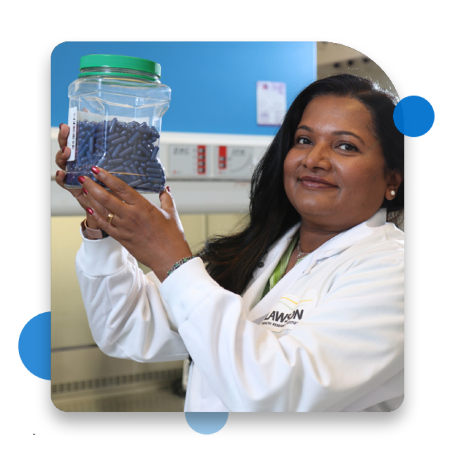 Scientist holding FMT Capsules