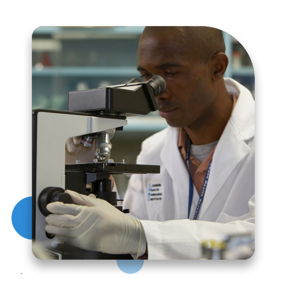 Scientist using a microscope