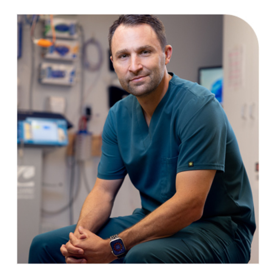 Dr Keith McIntosh seated in a surgical room