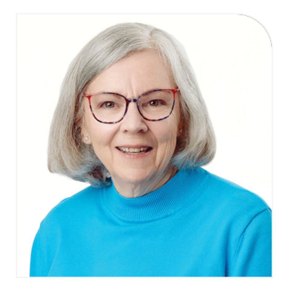 Vikkie Gibson wearing glasses smiling