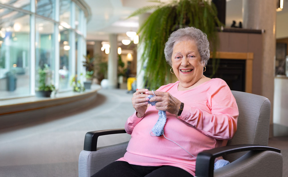 Fern McNab crocheting and smiling