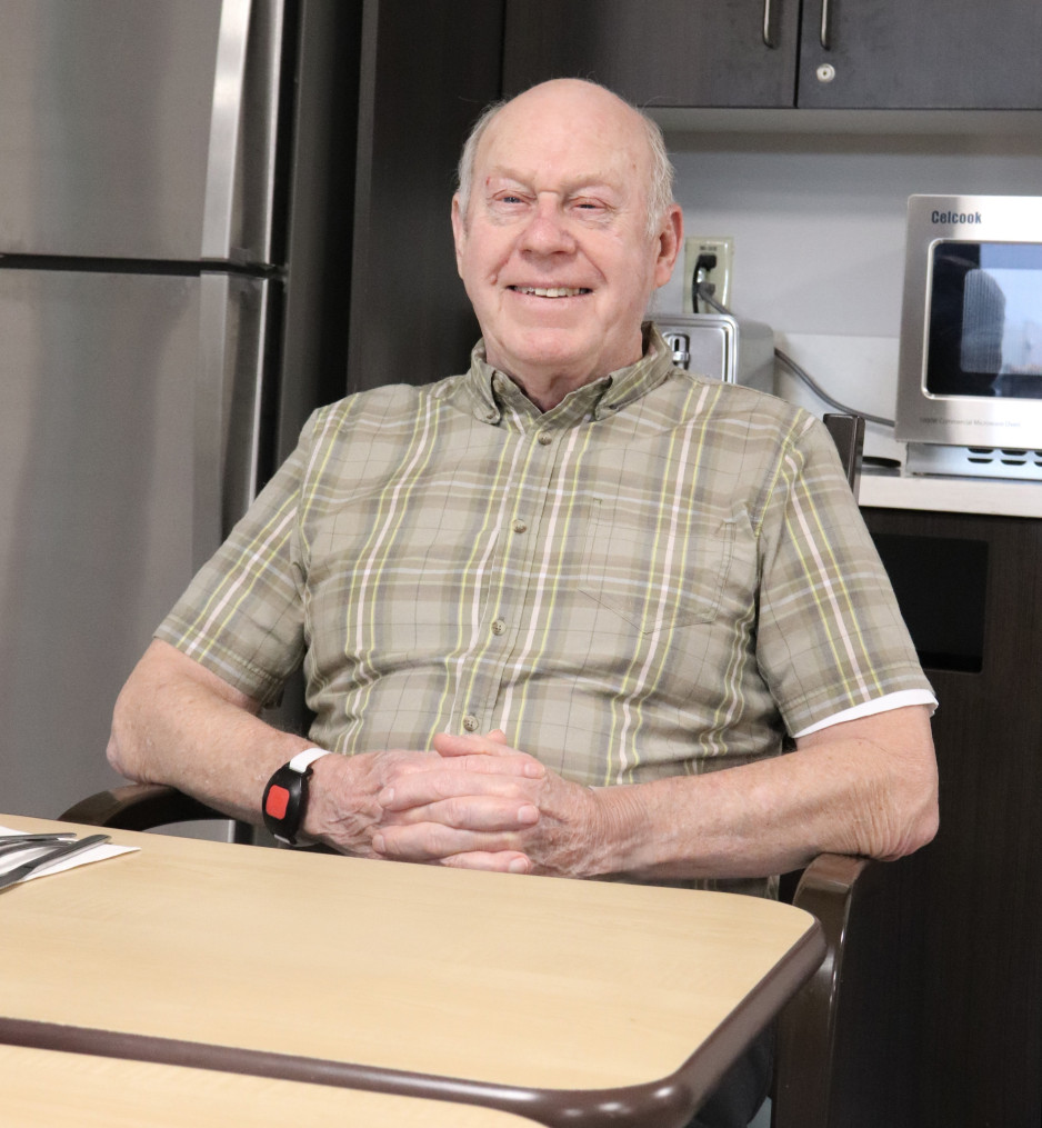 Veteran Joseph "Lou" Warren sits at his usual table in the dining room
