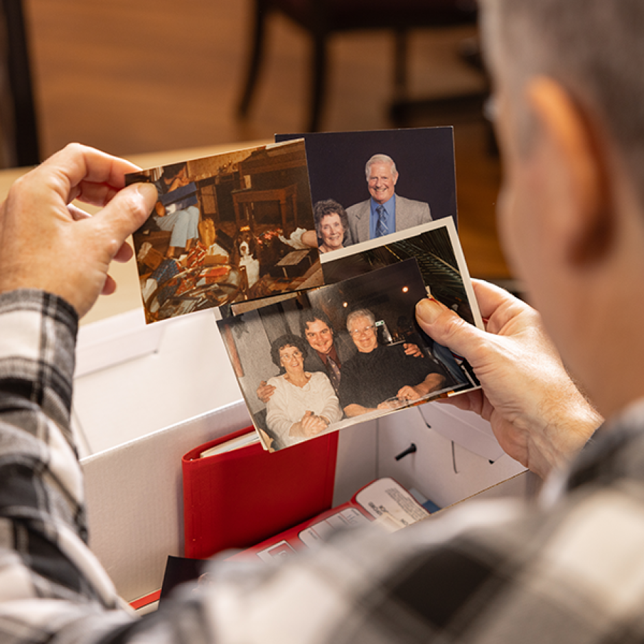 A veteran looking at a photo book