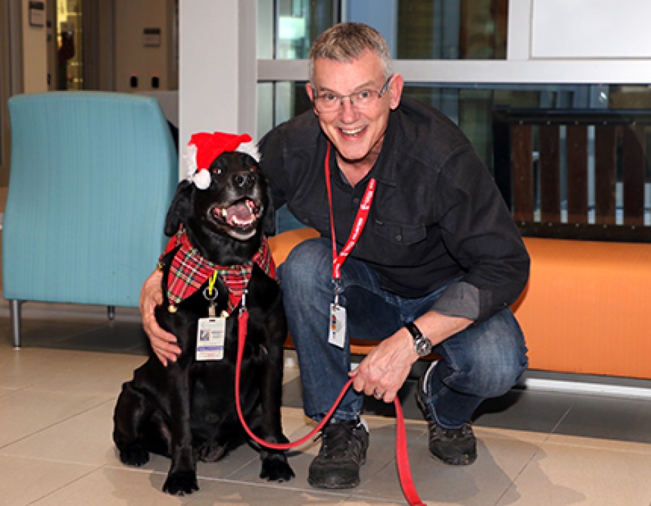 Halle the therapy dog and Roger Littlejohns